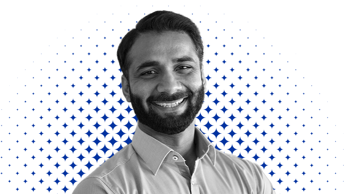 176127624-happy-indian-business-man-leader-manager-standing-in-office-headshot-portrait-